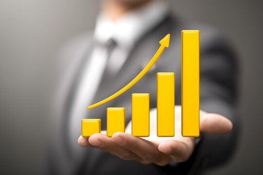 Businessman Holding 3D Bar Chart with Upward Growth Arrow. Hand presents yellow 3D bar chart showing financial growth success