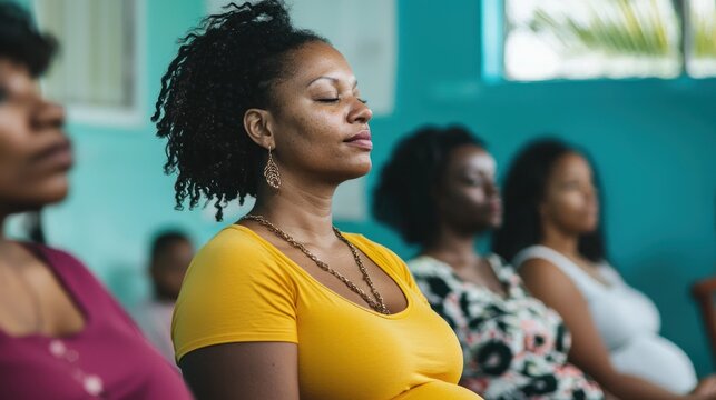 Pregnant women practicing breathing exercises in class.