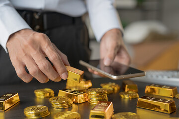 Gold Trading business man hand offering gold Investment in gold mining company or Trading gold on the stock exchange Rising gold prices.