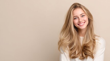 Fototapeta premium young woman with long blonde hair smiling. 