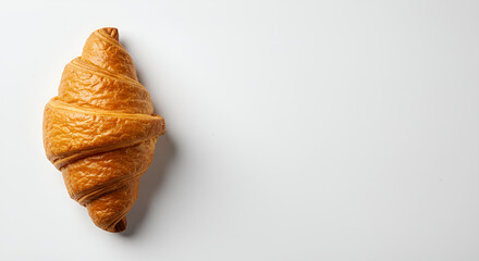 The golden croissant on pure white background with copy space 