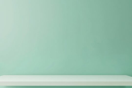 Empty white shelf against mint green wall