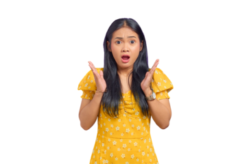 Portrait of shocked young Asian woman standing with arms raised and open mouth isolated on transparent background