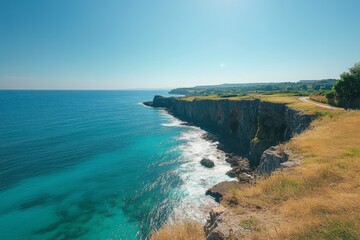 Fototapeta premium Aerial view of coastal cliff and turquoise ocean waves