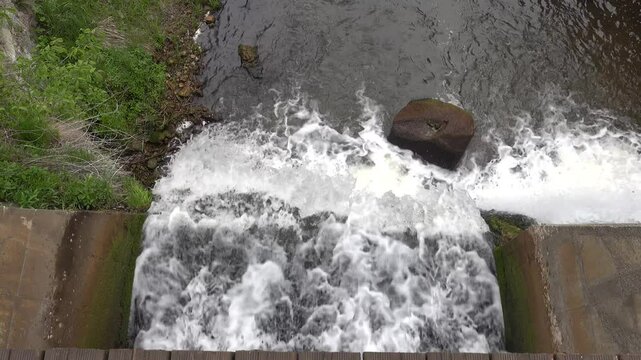 Kuldiga, Latvia Water flowing over the Venta River waterfall, the widest in Europe, 270 meters wide. 