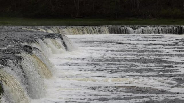 Kuldiga, Latvia Water flowing over the Venta River waterfall, the widest in Europe, 270 meters wide. 