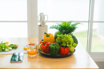 A fresh assortment of colorful vegetables, orange juice,milk highlights a balanced diet.The measuring tape symbolizes healthy eating,weight control,nutrition-focused lifestyle choices for wellness