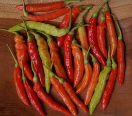 Capsicum frutescens on the wooden plate
