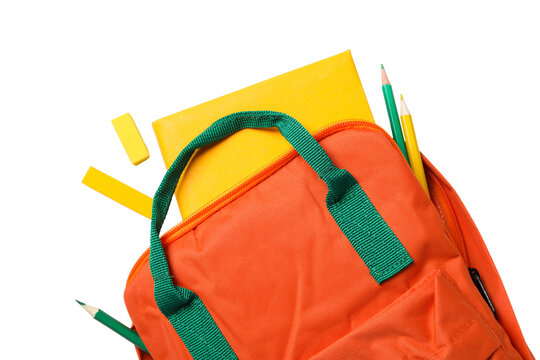 Bright orange backpack with school supplies on a white surface, isolated on white, PNG