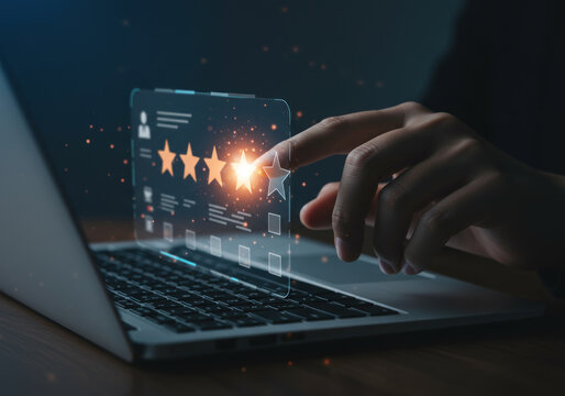 Person using laptop with star on screen.