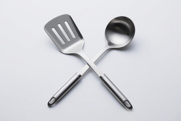 Crossed Kitchen Tools on White