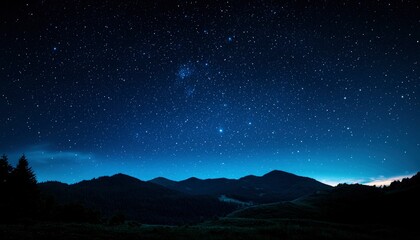 Naklejka premium Starry night over mountains