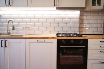 A beautiful kitchen detail with white cabinets