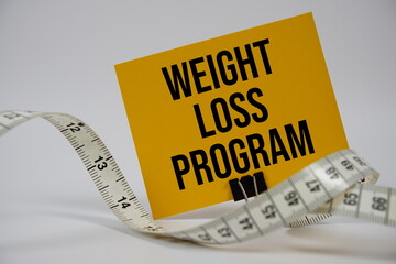 Weight Loss Program text with alarm clock on white background