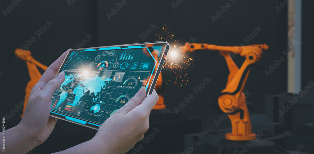 Wall mural industry engineer in smart factory using transparent glass tablet to control automated robotic arm w