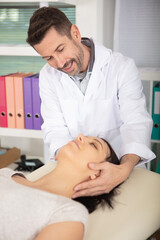male specialist carrying out rehabilitation physiotherapy