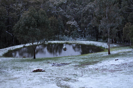 Light snow coverage around dam