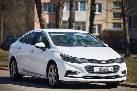 Mir, Belarus - April, 2 2025: 2017 Chevrolet Cruz second generation white. Chevy, division of General Motors parked in street.