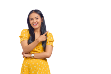 Portrait of smiling young Asian woman pointing finger at copy space isolated on transparent background