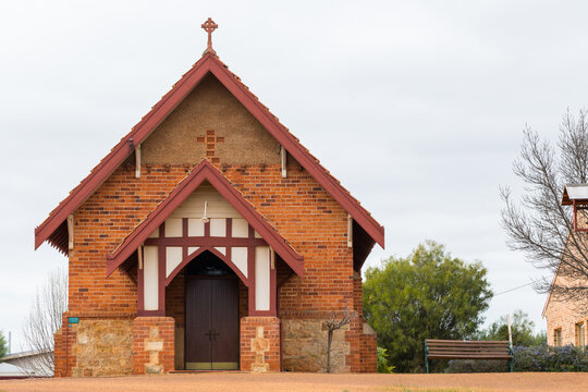 Small country church with cross on gabled roof