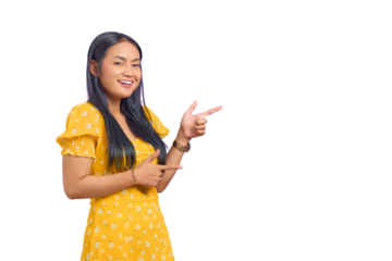 Portrait of smiling young Asian woman pointing finger at copy space isolated on transparent background