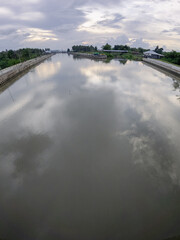Calm River Reflecting Cloudy Sky