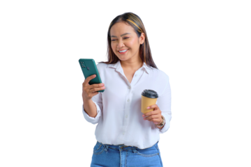Portrait of smiling young Asian woman looking at mobile phone and drinking coffee isolated on transparent background