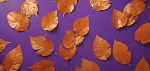 Obraz premium Dried orange metallic leaves, violet backdrop Geometric autumnal design , fall, decor, stock photo
