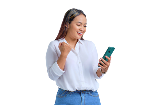 Excited young Asian woman using mobile phone gesturing yes with raised fist reacting to online news isolated on transparent background