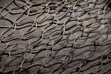 Fishing net on rustic old wood, fishing concept, art craft themes
