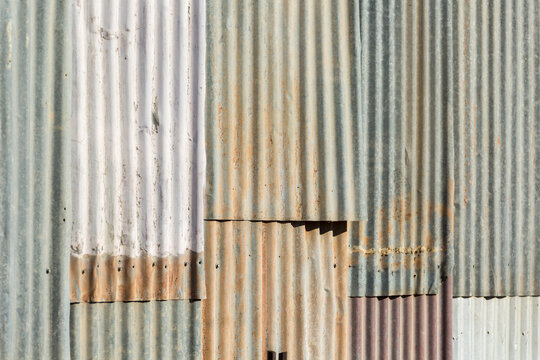 Old sheets of corrugated iron on a wall