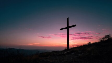 Silhouette cross at sunset