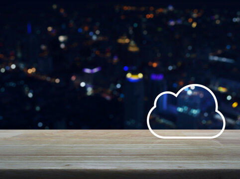  Cloud computing icon with copy space on wooden table over blur colorful night light modern city tower and skyscraper, Technology cloud computing concept