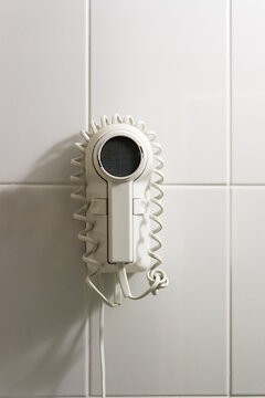 old fashioned hair dryer in cheap motel