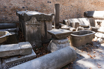 An outdoor display featuring ancient stone artifacts and ruins