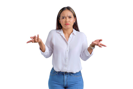 Attractive young Asian woman standing and shrugging shoulders with confused expression isolated on transparent background