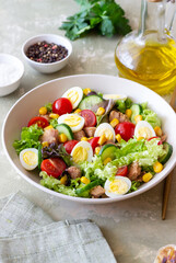 Salad with tuna, eggs, tomatoes, cucumbers and corn. Healthy eating. Diet.
