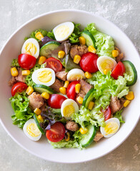 Salad with tuna, eggs, tomatoes, cucumbers and corn. Healthy eating. Diet.