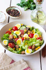 Salad with tuna, eggs, tomatoes, cucumbers and corn. Healthy eating. Diet.