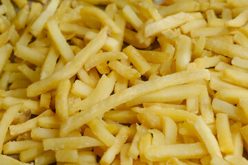 Fast food. Golden french fries background.