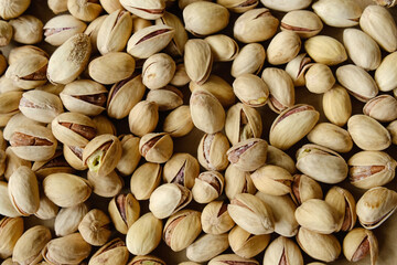 Pile of pistachios nuts. Food background.