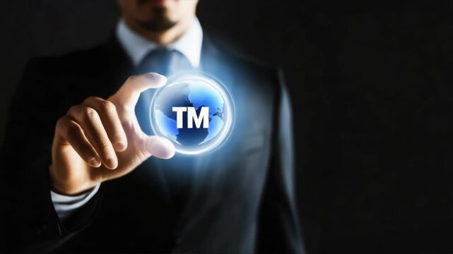 Businessman touching virtual tm button on black background, highlighting importance of intellectual property, copyright protection, ip rights in business identity
