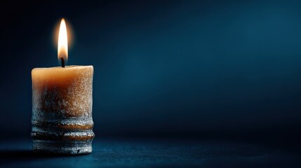 Candlelight Serenity: A solitary candle emits a warm, flickering glow against a deep blue backdrop, the embodiment of peaceful contemplation and reflection.