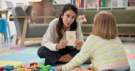 Learning, help and speech therapy for kid, education or giraffe card for language development. Child, woman and counseling session in psychology office for phonics, smile or teaching girl with autism - Powered by Adobe