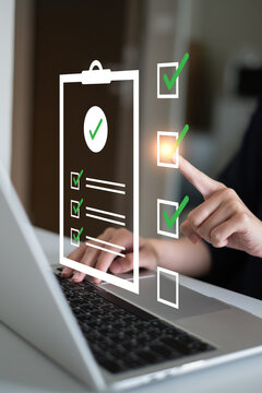 Close-up hand businessman doing checklist document survey list quality questionnaire choice form mark concept
