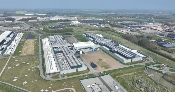 data center, computing center in Odense, Denmark, big tech, IT, Ai, infrastructure, Aerial drone video of the complex.