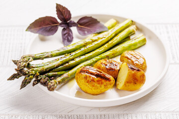 Grilled asparagus and golden baby potatoes