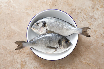 Fresh raw sea bream fish or dorado fish, top view