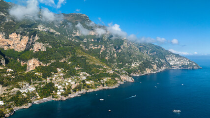 Obraz premium Aerial view of the Amalfi Coast, in the province of Salerno, Campania, Italy. This coastal panorama is one of the most beautiful and touristic on the Italian peninsula. In background it's Praiano town