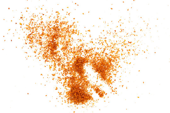 hot red chili powder on white background isolated. shot with high angle view